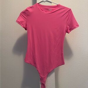 Pink Skims-like bodysuit